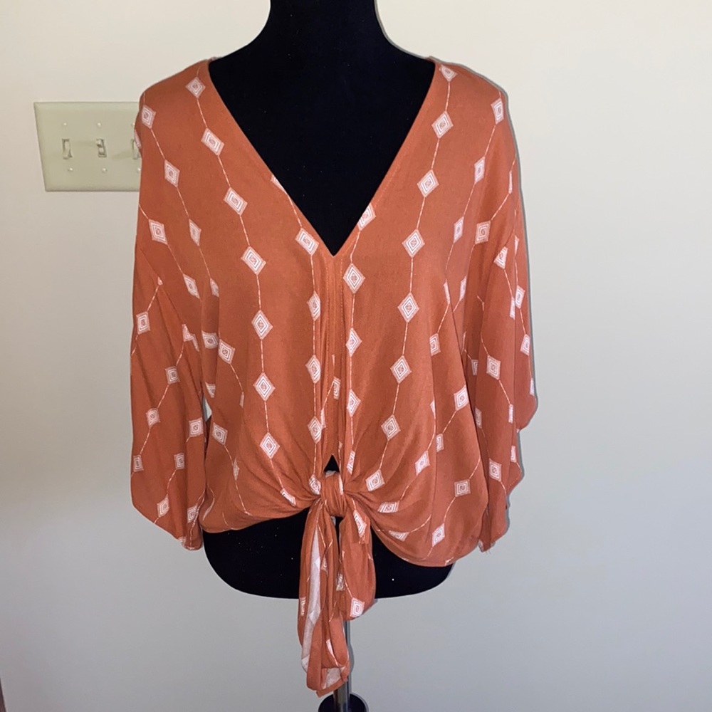orange top w tie